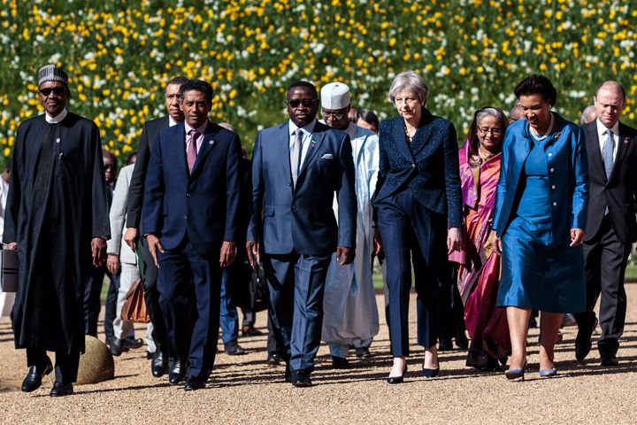 Prime Minister Theresa May walks with commonwealth leaders at Windsor Castle during the Commonwealth Heads of Government Meeting on Friday.