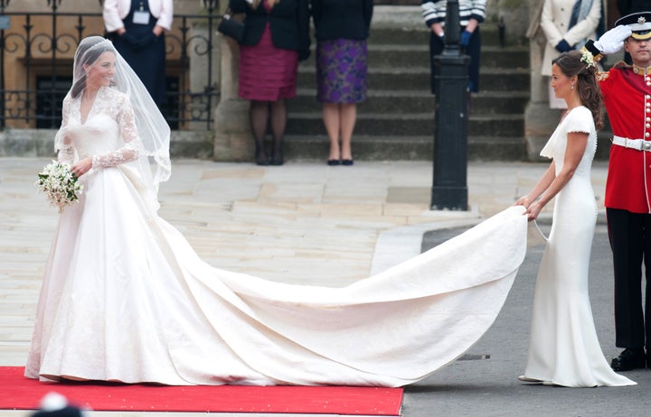 Kate Middleton arrives at Westminster Abbey on her wedding day, April 29, 2011, wearing the now-famous long-sleeved Sarah Burton for Alexander McQueen gown. 