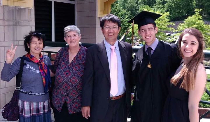 Reverend John Sanqiang Cao (center) poses in a photo with his family. The elder Cao has Chinese citizenship and American residence.