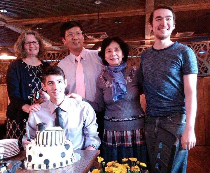 Rev. Cao poses with family members.