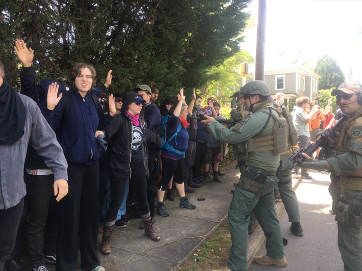 Police officers corner a group of counterprotesters at a neo-Nazi rally in Georgia on Saturday.