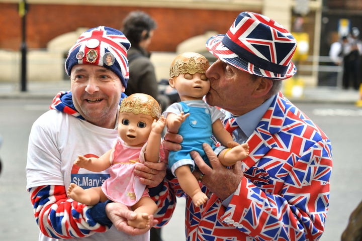 Royal fans John Loughrey (left) and Terry Hutt hold dolls outside the Lindo Wing at St Mary's Hospital in Paddington, London, where the Duchess of Cambridge has been admitted in the early stages of labour.