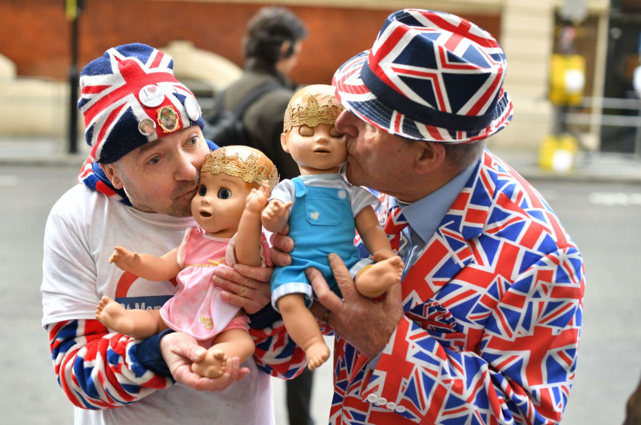 John Loughrey, left, and Terry Hunt show off their robotic baby dolls outside St Mary's Hospital in Paddington.
