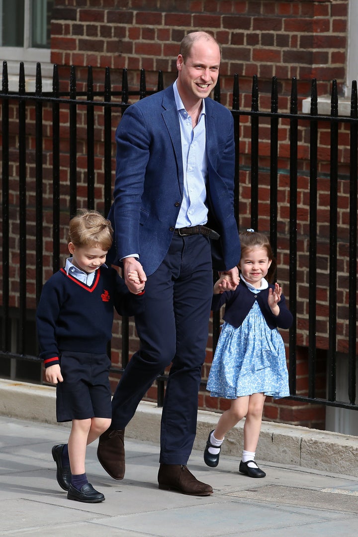 Prince William arrives at St. Mary's Hospital with Prince George and Princess Charlotte to see the new baby.