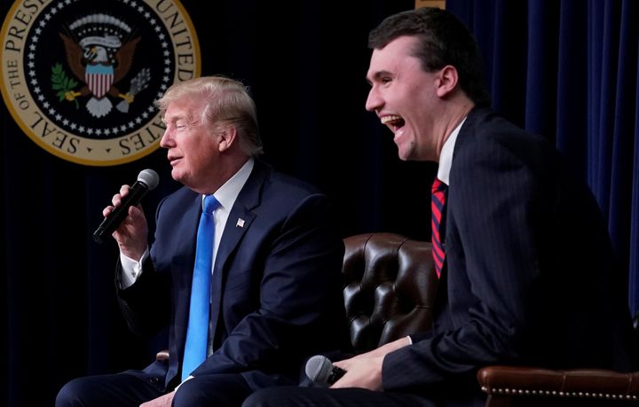 Turning Point USA founder Charlie Kirk laughs after President Donald Trump says at a White House youth forum on March 22 that if he could go back in time and give himself advice at age 25, it would be to not run for president.