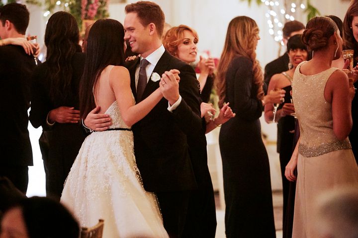 TV couple Rachel and Mike share a dance at their wedding reception. 