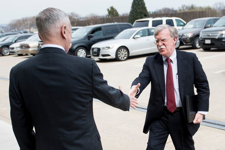 Secretary of Defense Jim Mattis, left, greets incoming national security adviser John Bolton outside the Pentagon on March 29. Bolton's new deputy had been a thorn in Mattis' side when he was filling out his staff.