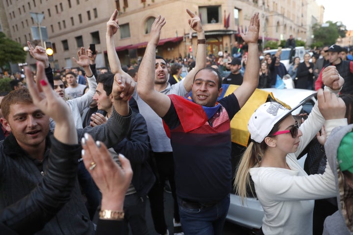 People celebrate in in central Yerevan after Prime Minister Serzh Sargsyan announced his resignation following mass protests.