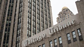 Chicago Tribune signage is displayed on the side of the Tribune Tower in Chicago, Illinois, U.S., on Friday, March 28, 2014. Tribune Co., the Chicago-based media company, reported that fourth quarter revenue dropped 11% to $773.4 million. Photographer: Daniel Acker/Bloomberg via Getty Images