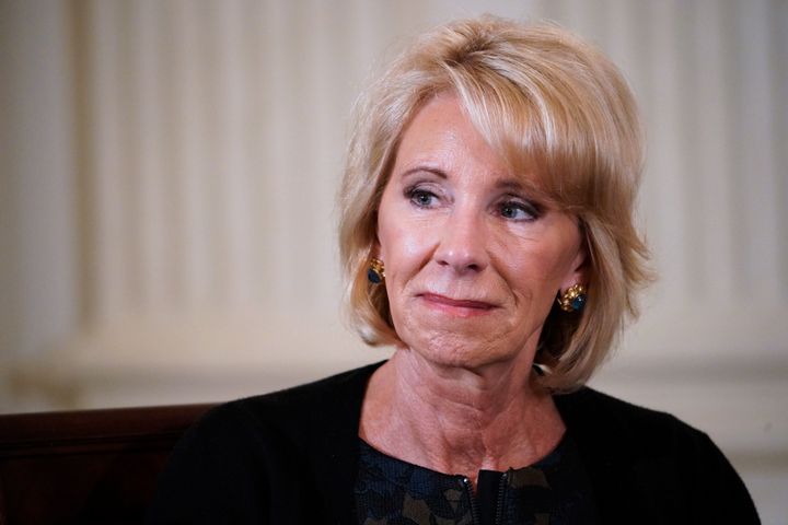 Education Secretary Betsy DeVos takes part in a listening session on gun violence with teachers and students in the White House on Feb. 21, 2018.