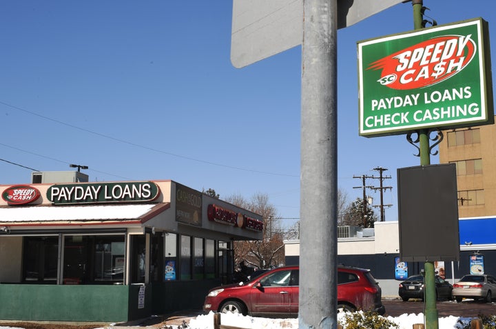 A women walks into the payday lender Speedy Cash on Feb. 21, 2018, in Lakewood, Colorado.