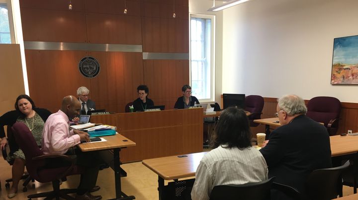 Three members of the Oregon Psychiatric Security Review Board (back) take testimony about releasing patients hospitalized as criminally insane.