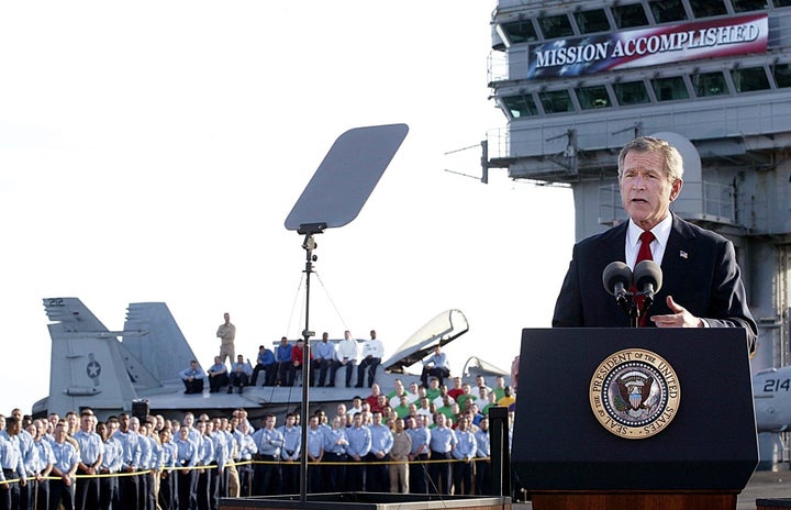 President George W. Bush addresses the nation on May 1, 2003, in front of the now-infamous "Mission Accomplished" banner.
