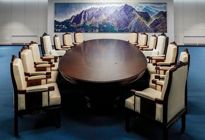 A specially made oval table is exactly 2,018 millimeters across to symbolize "the year the historic summit is being held.”