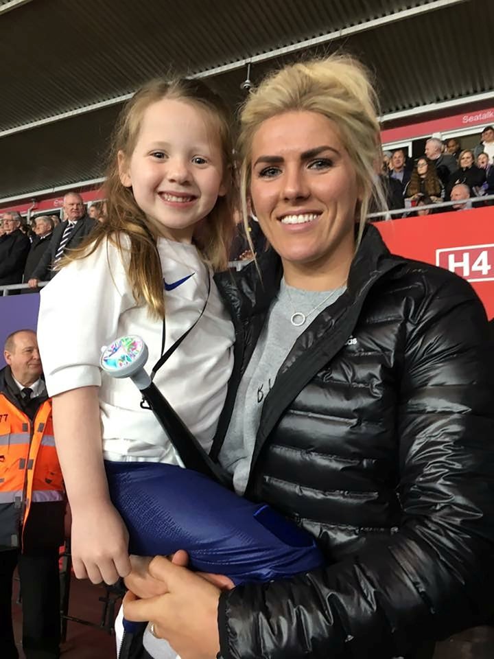 Jessie Adams with Millie Bright, a Sheffield player. 