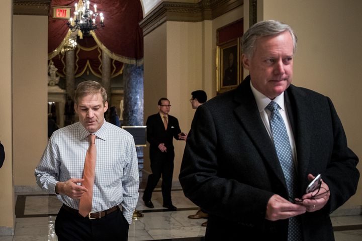 Rep. Jim Jordan (R-Ohio), left, of the House Freedom Caucus walks with the caucus's chairman, Rep. Mark Meadows (R-N.C.), on Capitol Hill in December.