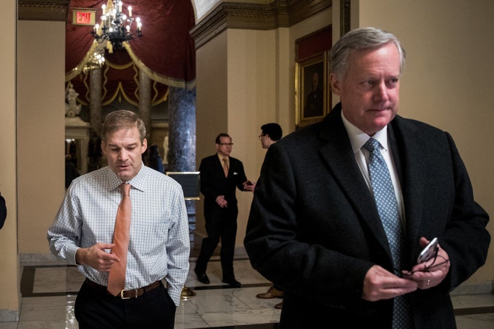 Rep. Jim Jordan (R-Ohio), left, of the House Freedom Caucus walks with the caucus's chairman, Rep. Mark Meadows (R-N.C.), on