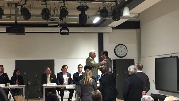 Usama Ghamhi jumped on the stage to confront the Tory candidates at the Kensington and Chelsea hustings.
