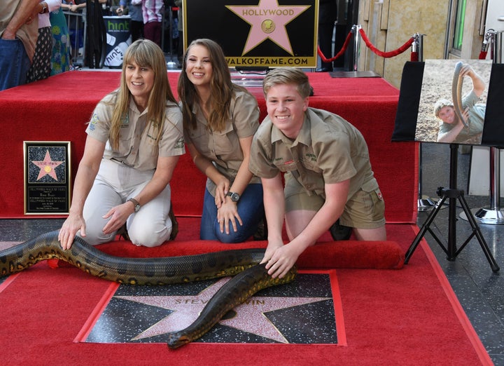 Terri Irwin, Bindi Irwin and Robert Irwin touch the newly unveiled star of Steve Irwin, who was honored posthumously with a S