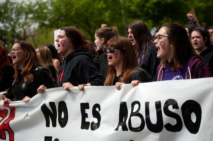 Demonstrators in Pamplona chant and hold banners that read, "It is not abuse, it is assault" after the verdict was reached.