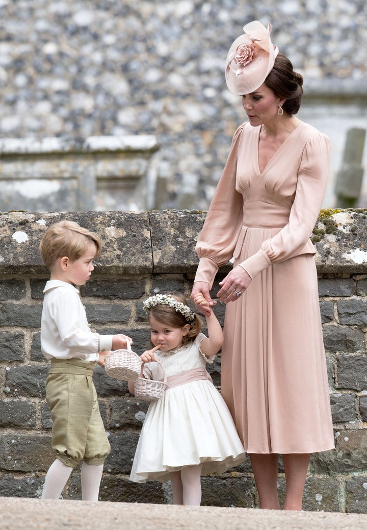 Kate with George and Charlotte at the wedding of her sister Pippa Middleton and James Matthews on 20 May 2017.