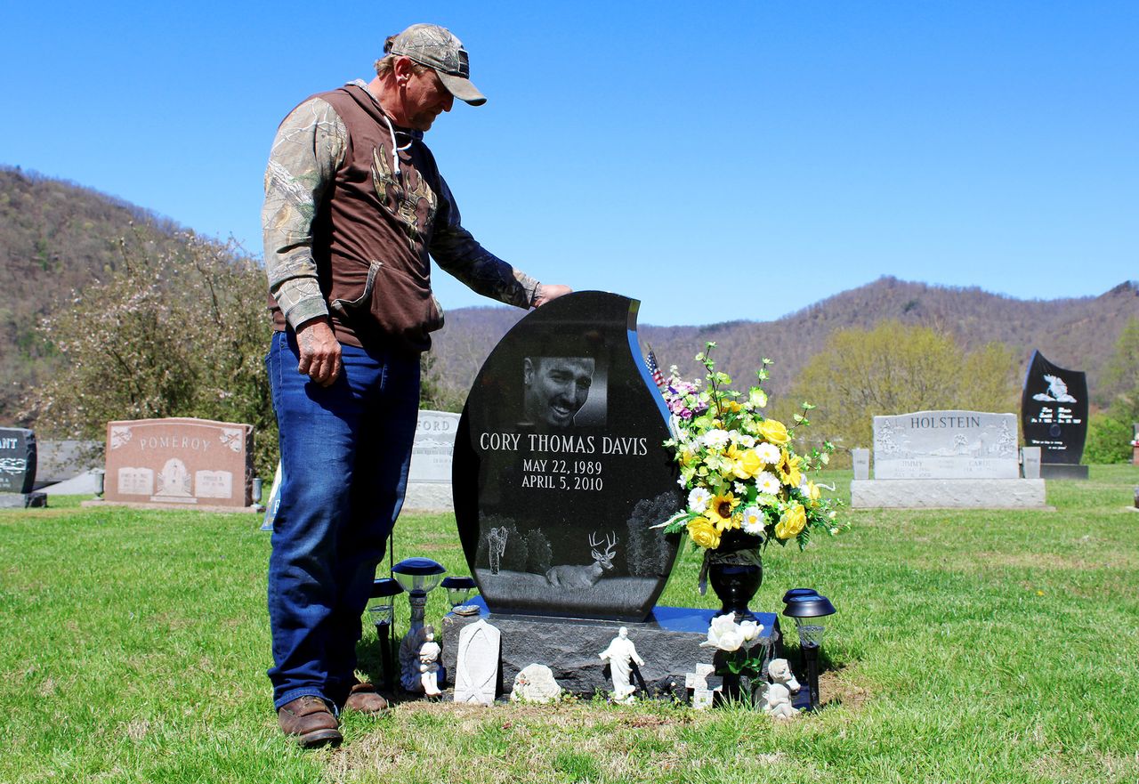 Davis visits his son's grave.