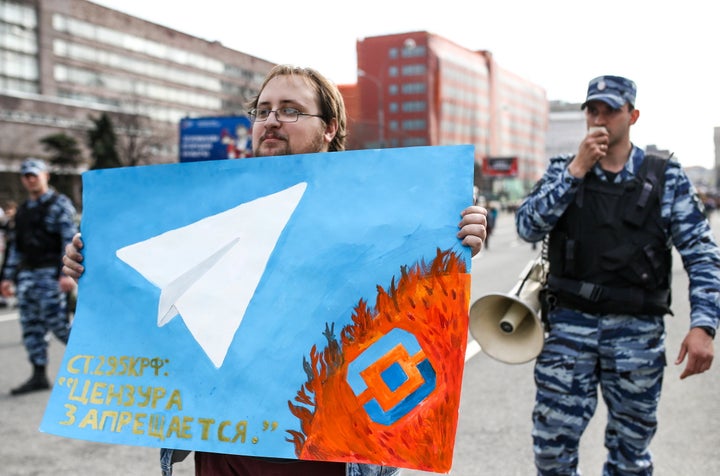 A man holds a poster as he takes part in a rally for "free Internet" and in support of the Telegram Messenger in Akademika Sakharova Avenue.