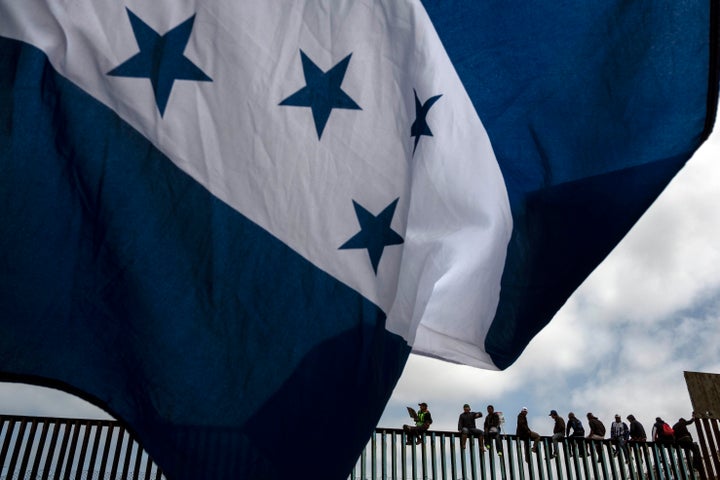 Central American migrants traveling in a caravan demonstrate at the U.S.-Mexico border on April 29. The Trump administra