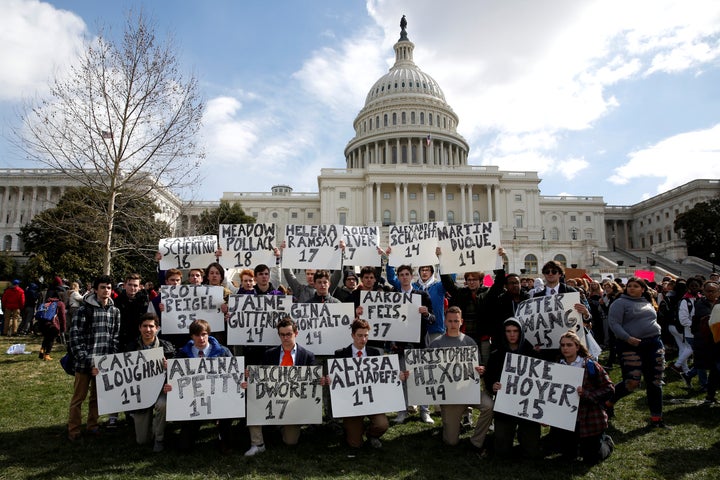 Students from Gonzaga College High School in Washington, D.C., hold up signs on March 14 that have the names of the victims of the school shooting in Parkland, Florida.