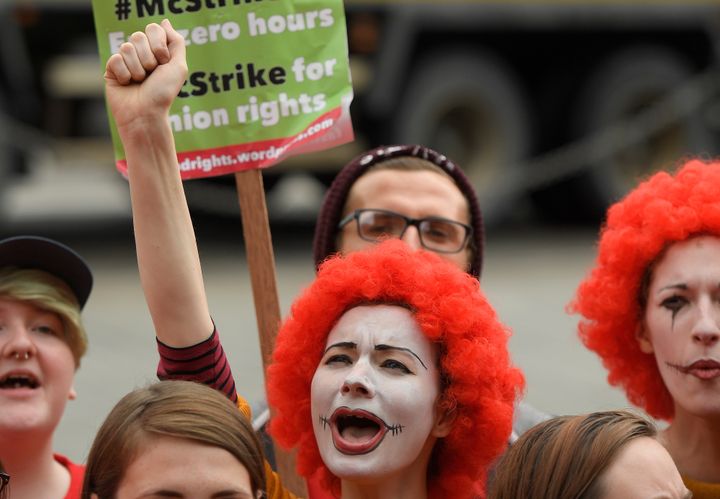 Protestors demonstrate in support of workers at British McDonald's restaurants striking in a protest over pay and other industrial relations issues last September (file photo).
