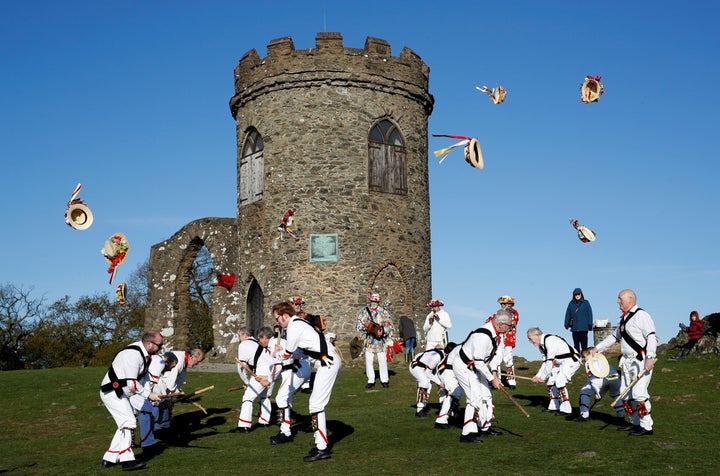 Leicester Morrismen throw their hats during May Day celebrations at Bradgate Park in Newtown Linford, 2018