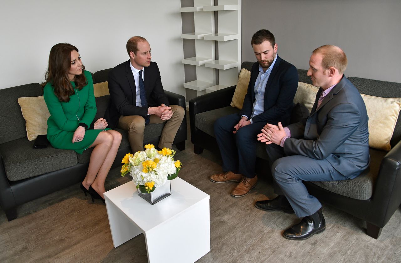 Prince William and Catherine, Duchess of Cambridge, speak with Benjamin and Neil Laybourn who helped him on the bridge that day.