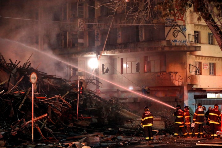 Firefighters try to extinguish a fire at a building in downtown Sao Paulo, Brazil, on May 1.