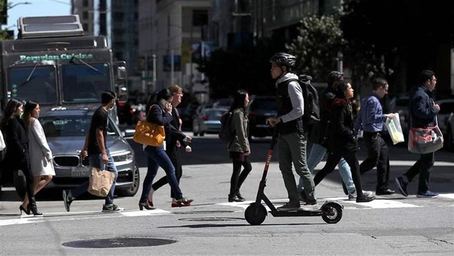 A scooter rider in San Francisco. The city’s attorney sent cease-and-desist letters to scooter companies. Other cities, in th