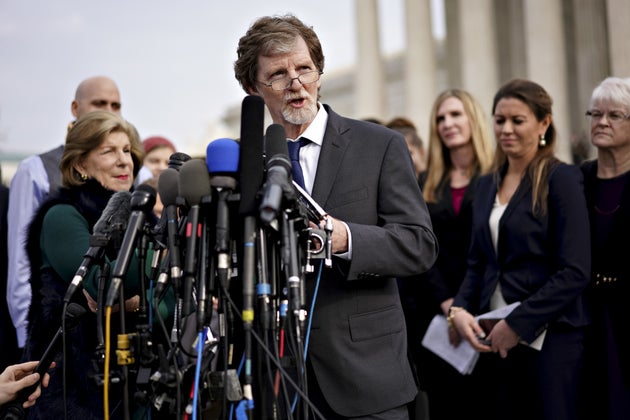Jack Phillips (center), the&nbsp;owner of Masterpiece Cakeshop, speaks to members of the media in Washington,...
