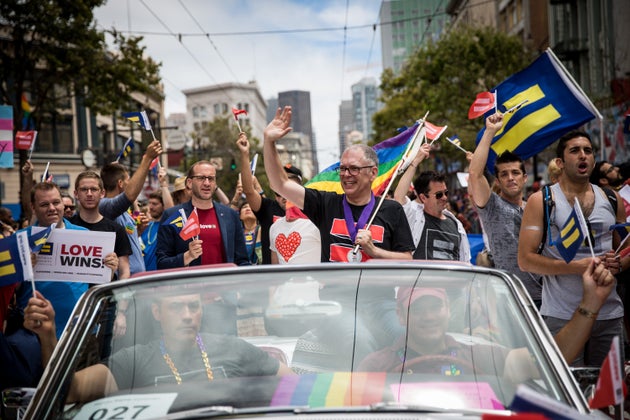 Supreme Court plaintiff Jim Obergefell rides in a convertible in the San Francisco Gay Pride Parade on...