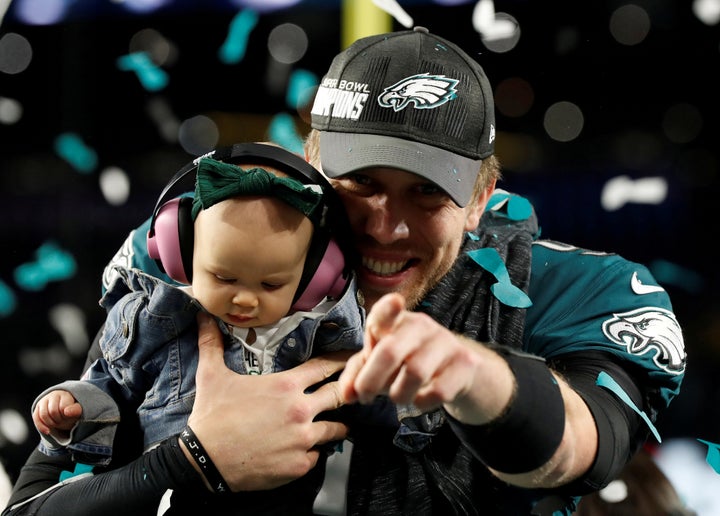 Nick Foles celebrates with daughter Lily after the Philadelphia Eagles win the Super Bowl on Feb. 4.