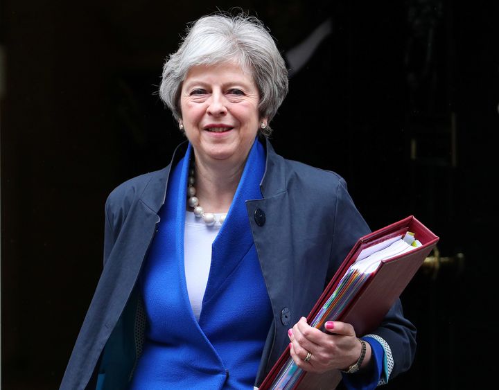 Britain's Prime Minister Theresa May walks out of 10 Downing Street.