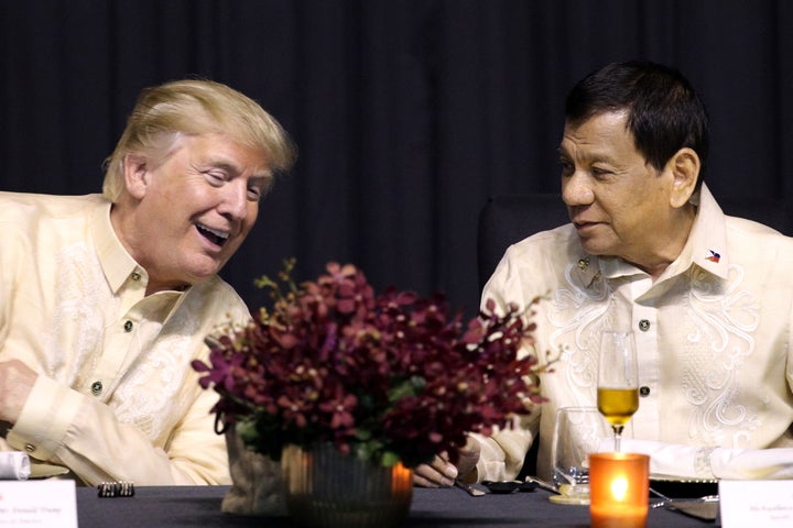 U.S. President Donald Trump speaks with Philippines President Rodrigo Duterte in Manila, Philippines, November 12, 2017.