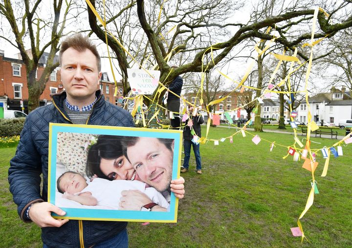 Richard Ratcliffe holds a photograph of himself with wife Nazanin and their daughter Gabriella. He said a the British Government's 'failure to solve key issues risked putting more Brits in danger'. 