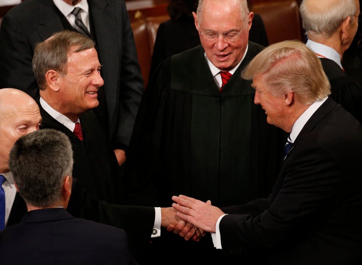 President Donald Trump greets members of the Supreme Court after he addressed a joint session of Congress on Feb. 28, 2017. 