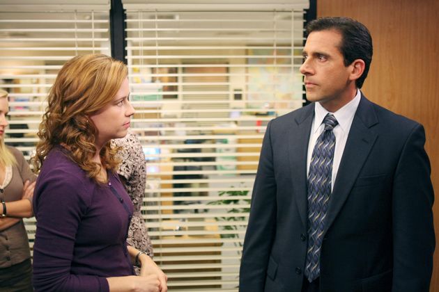 Jenna Fischer and Steve Carell in character during the 