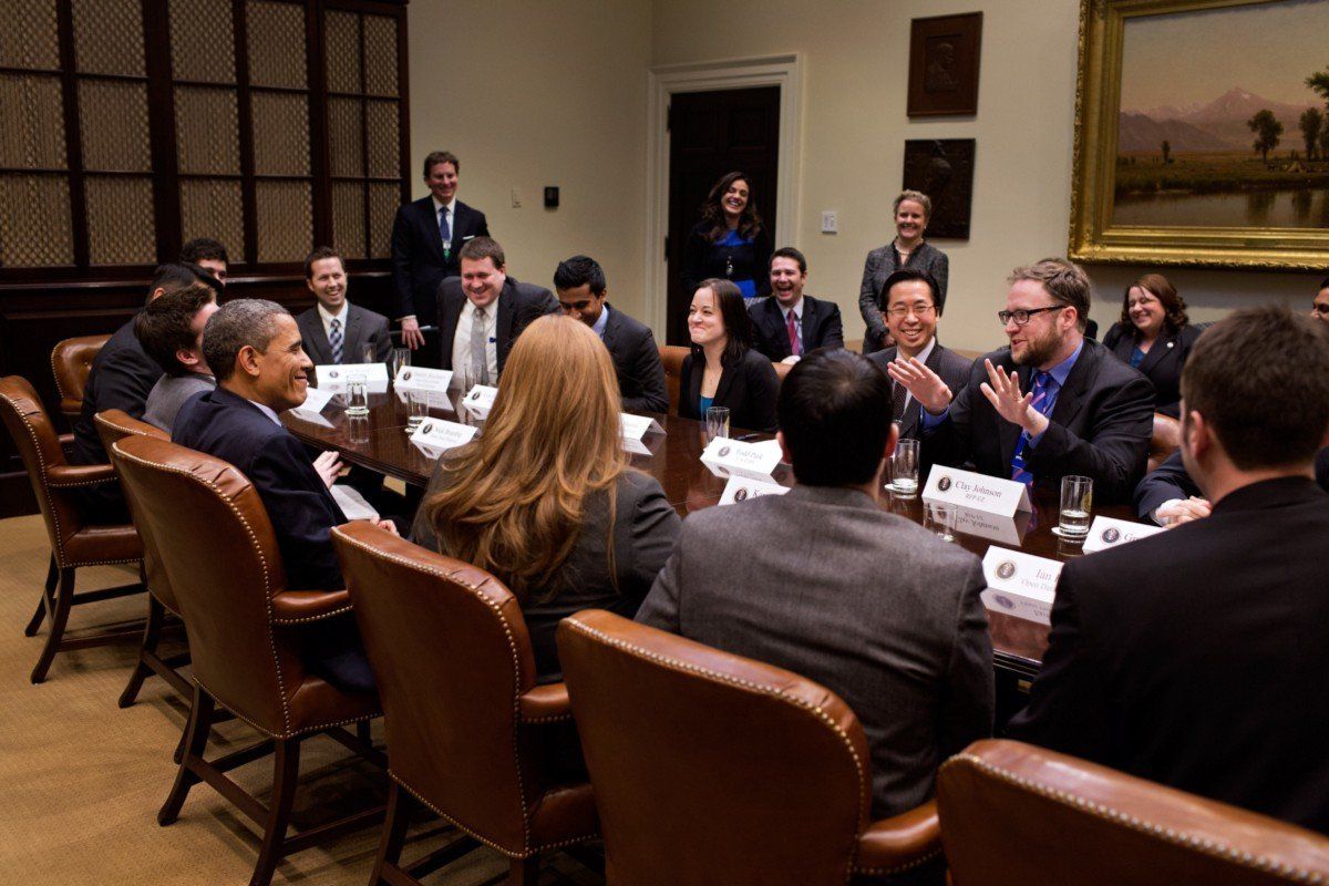 President Barack Obama meets with Clay Johnson and other Presidential Innovation Fellows in 2013. Johnson uses this photo as the banner on his Twitter page.