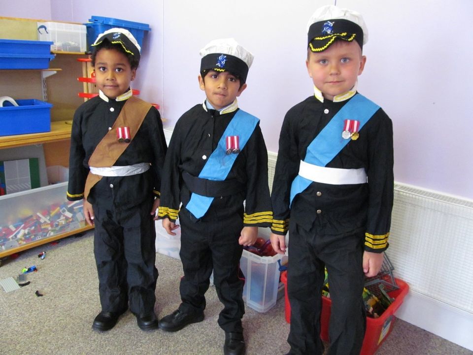 Some of the students getting into character ready for the Long Walk procession. From left to right, students dressed up as Prince William, Prince Harry and Prince Charles.