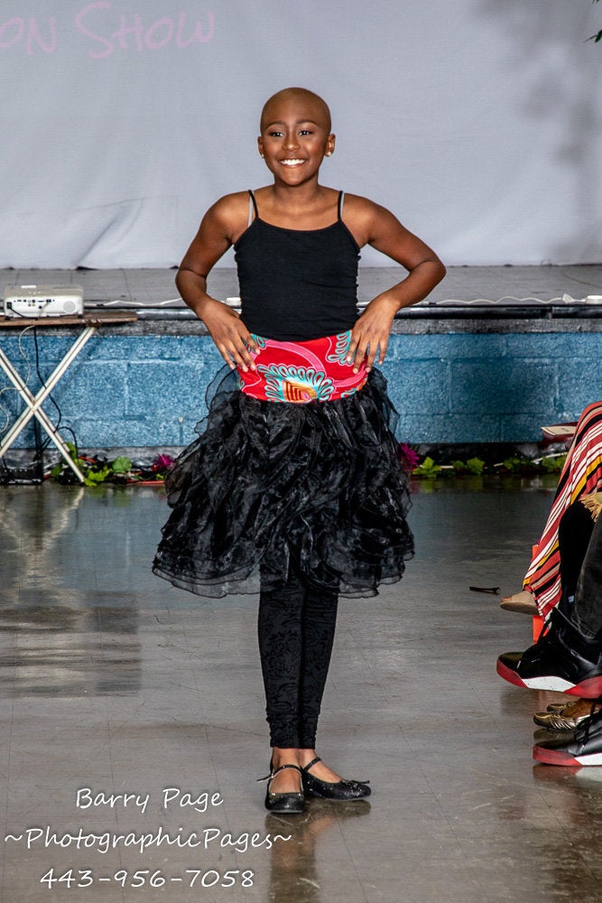 A model walks in Alyscia Cunningham's "I Am More Than My Hair" fashion show.