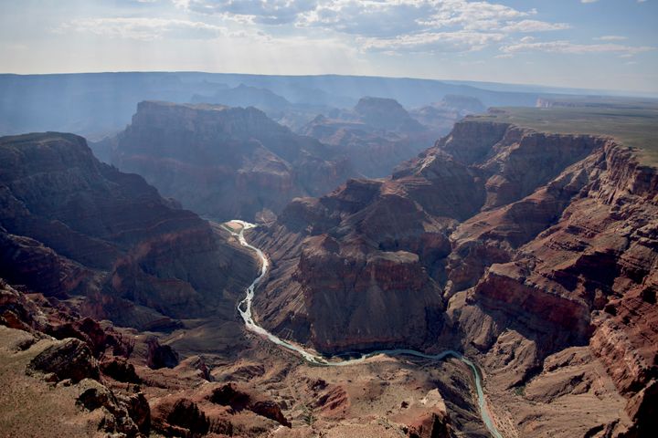 The confluence of the Little Colorado River, foreground, and the Colorado River is seen in Grand Canyon National Park in this aerial photograph taken above Grand Canyon, Arizona, U.S., on Thursday, June 25, 2015.