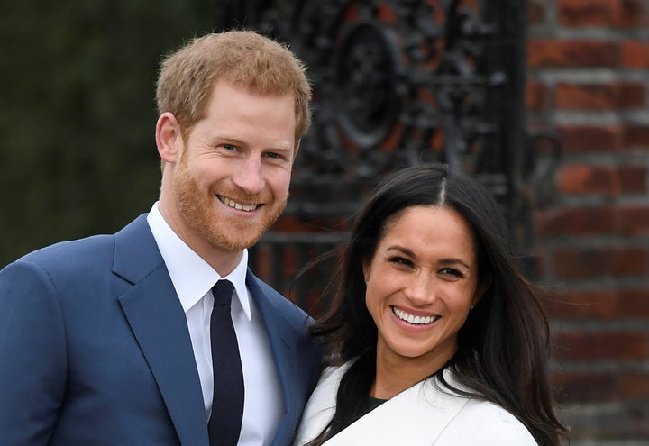 Prince Harry poses with Meghan Markle in the Sunken Garden of Kensington Palace, London, Britain, Nov. 27, 2017.