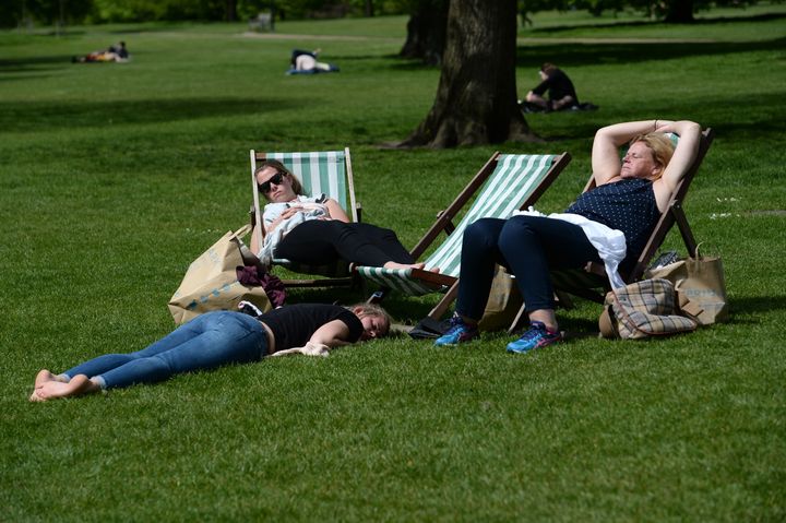People enjoy the sun in London's Hyde Park