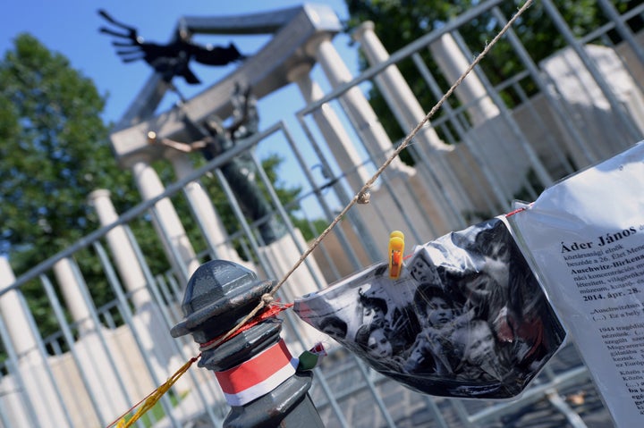 A photo of Jewish child victims is part of the counter-memorial in front of Hungary's monument commemorating the country's oc