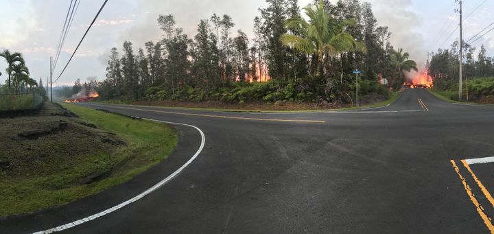 Lava advances along a street near a fissure in Leilani Estates on Saturday.